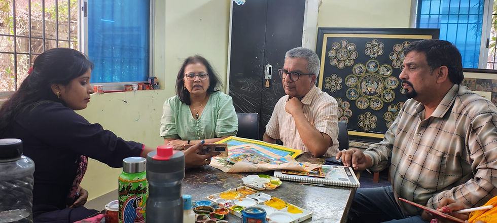 People discussing objects of art.
