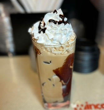 Rich espresso topped with velvety steamed milk and a thick layer of frothy foam, dusted with cocoa powder."

Traditional Mexican coffee brewed with cinnamon, piloncillo, and cloves, served in a rustic clay cup."
"Chilled, smooth-brewed coffee over ice, swirled with fresh cream for a refreshing pick-me-up."
