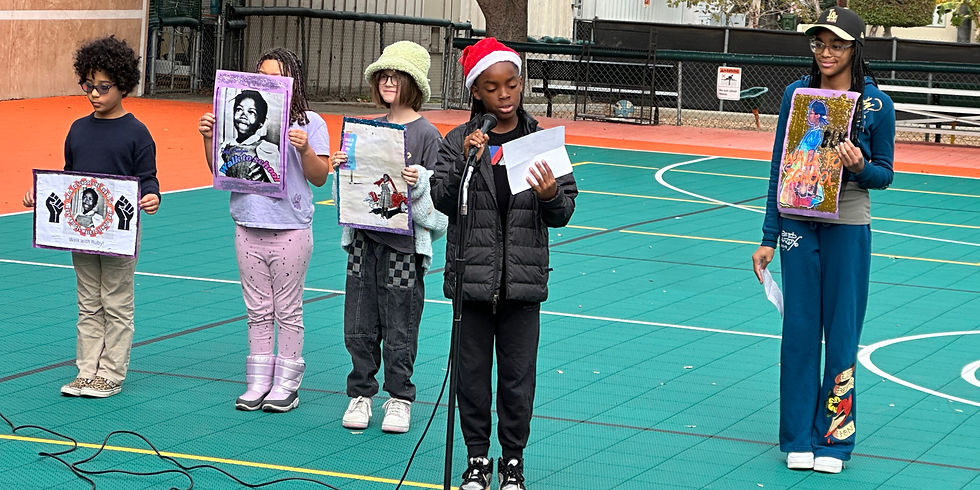Although due to the rain we weren't able to participate in the annual Ruby Bridges Walk to School Day, students helped prepare us for a Day of reflection and dialogue by displaying their posters and explaining the historical and cultural significance of Ruby Bridges as a civil rights activist.