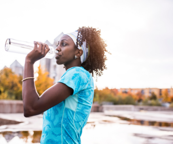 Lady staying hydrated in the summer.