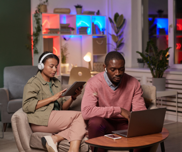 Couple looking at their digital devices