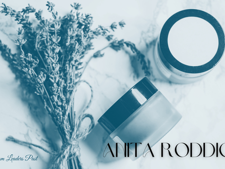 Sprigs of lavender, two jars on marble. Text: Lessons From Leaders Past, Anita Roddick. Blue tint enhances calm mood.