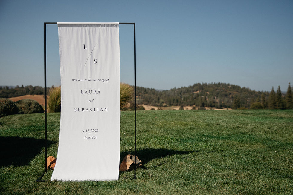 a sign that says welcome to the marriage of laura and sebastian