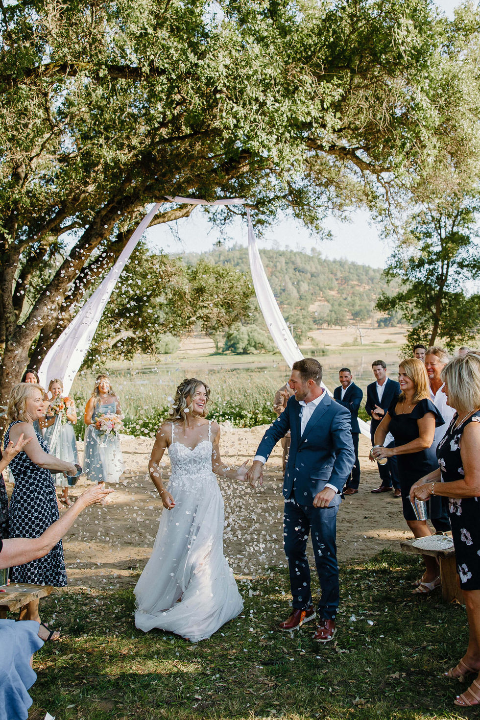 a bride and groom are showered with confetti at their wedding