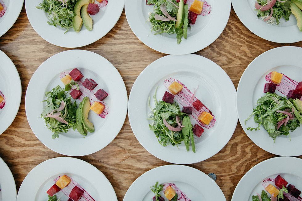 a bunch of plates with different types of food on them