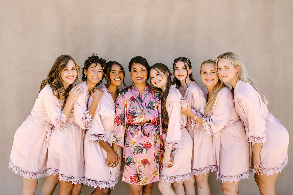 a bride and her bridesmaids are posing for a picture
