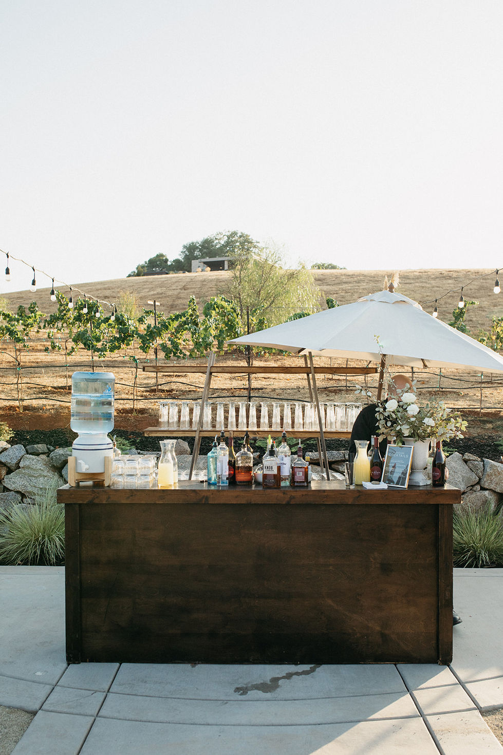 a wooden bar with bottles of liquor on it