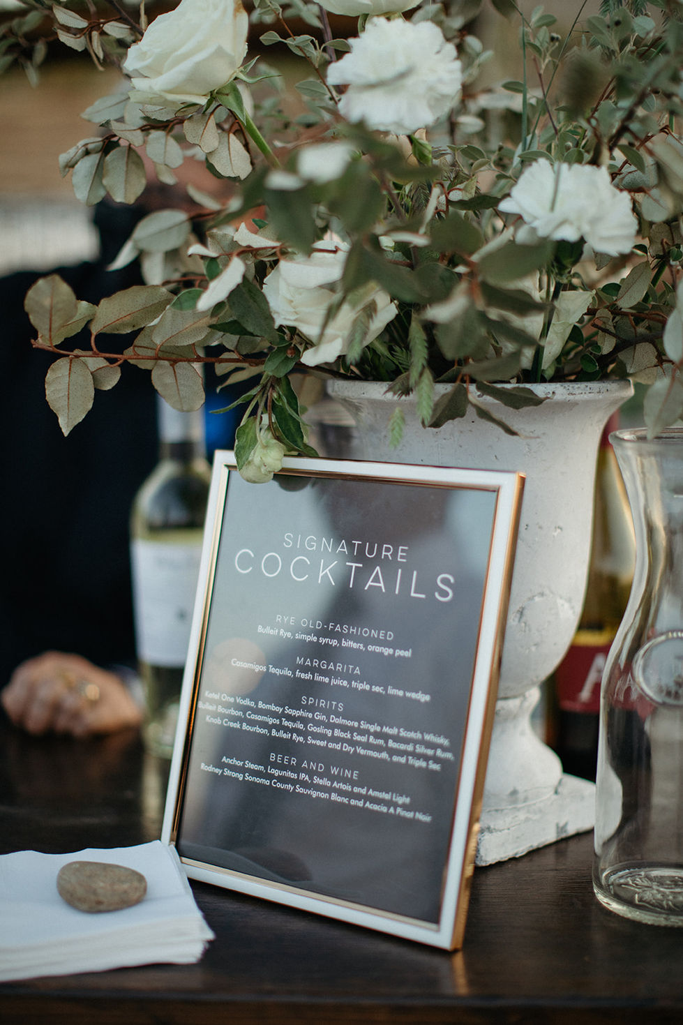a sign that says signature cocktails on it