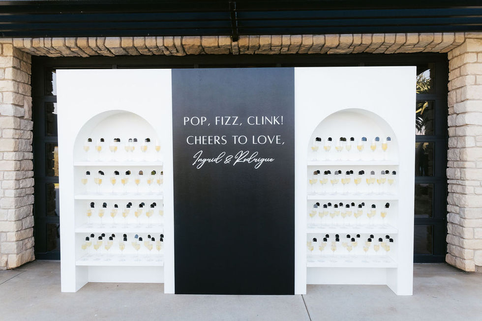 a black and white sign that says pop fizz clink cheers to love