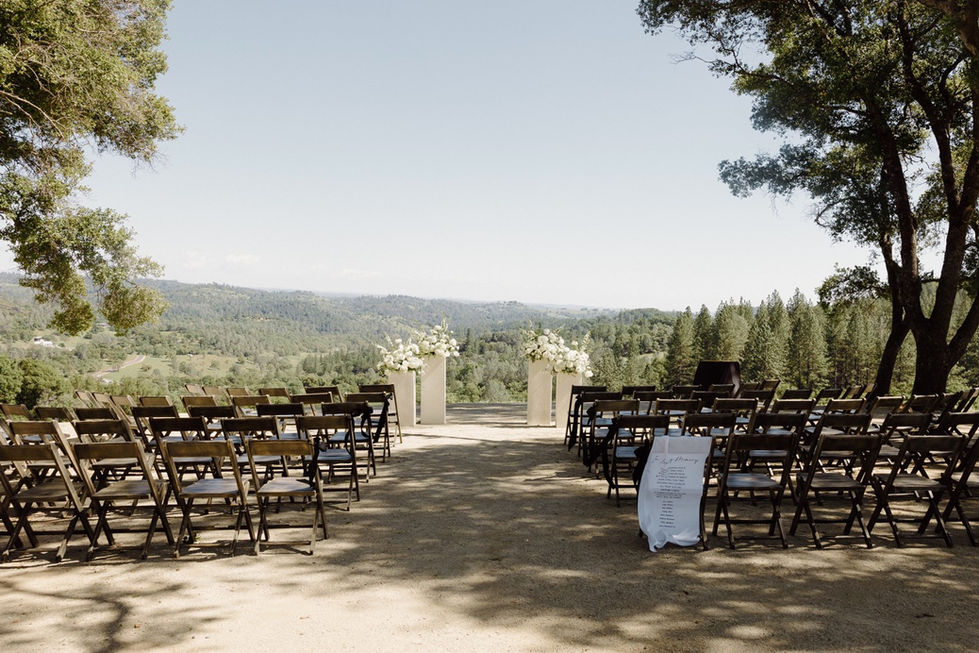 a row of folding chairs are set up for a wedding ceremony