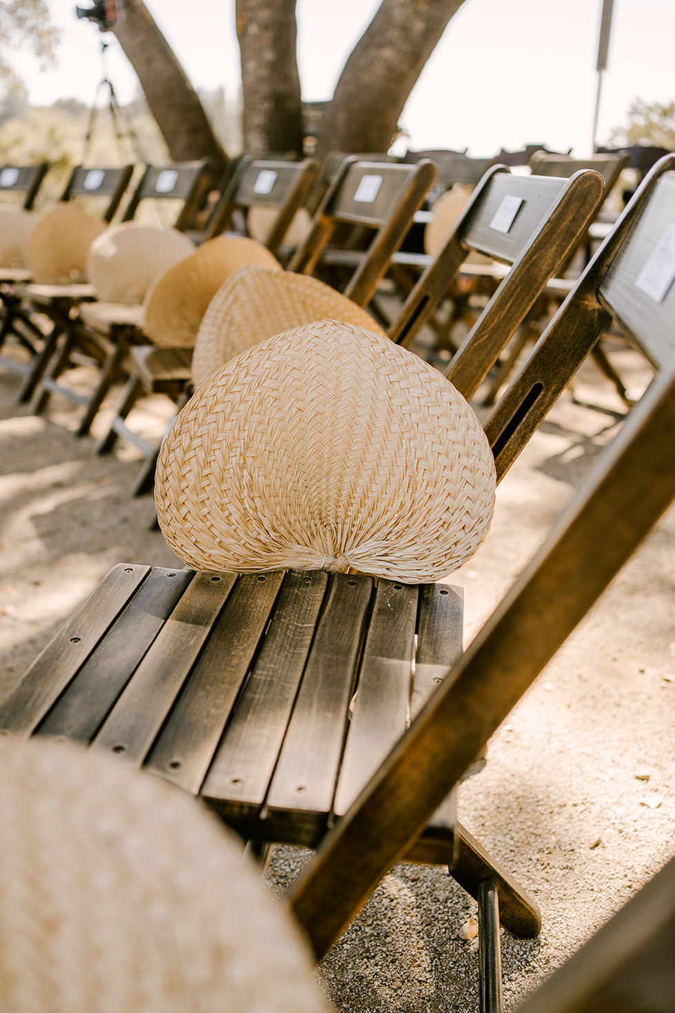 a wooden chair with a fan on it