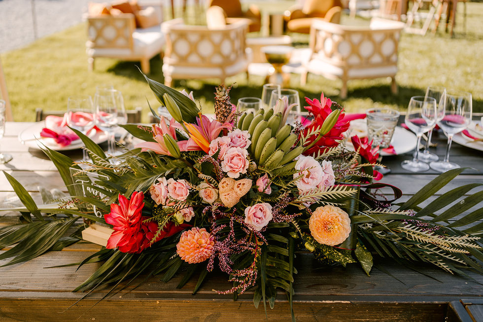 a table with a bunch of flowers and a table number