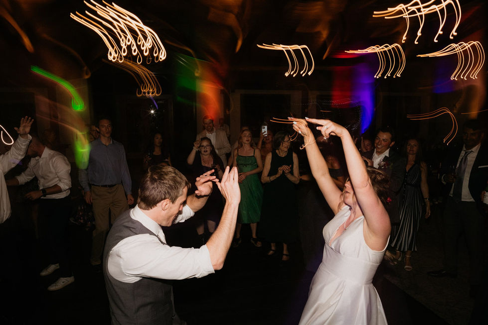 a bride and groom are dancing at a wedding reception