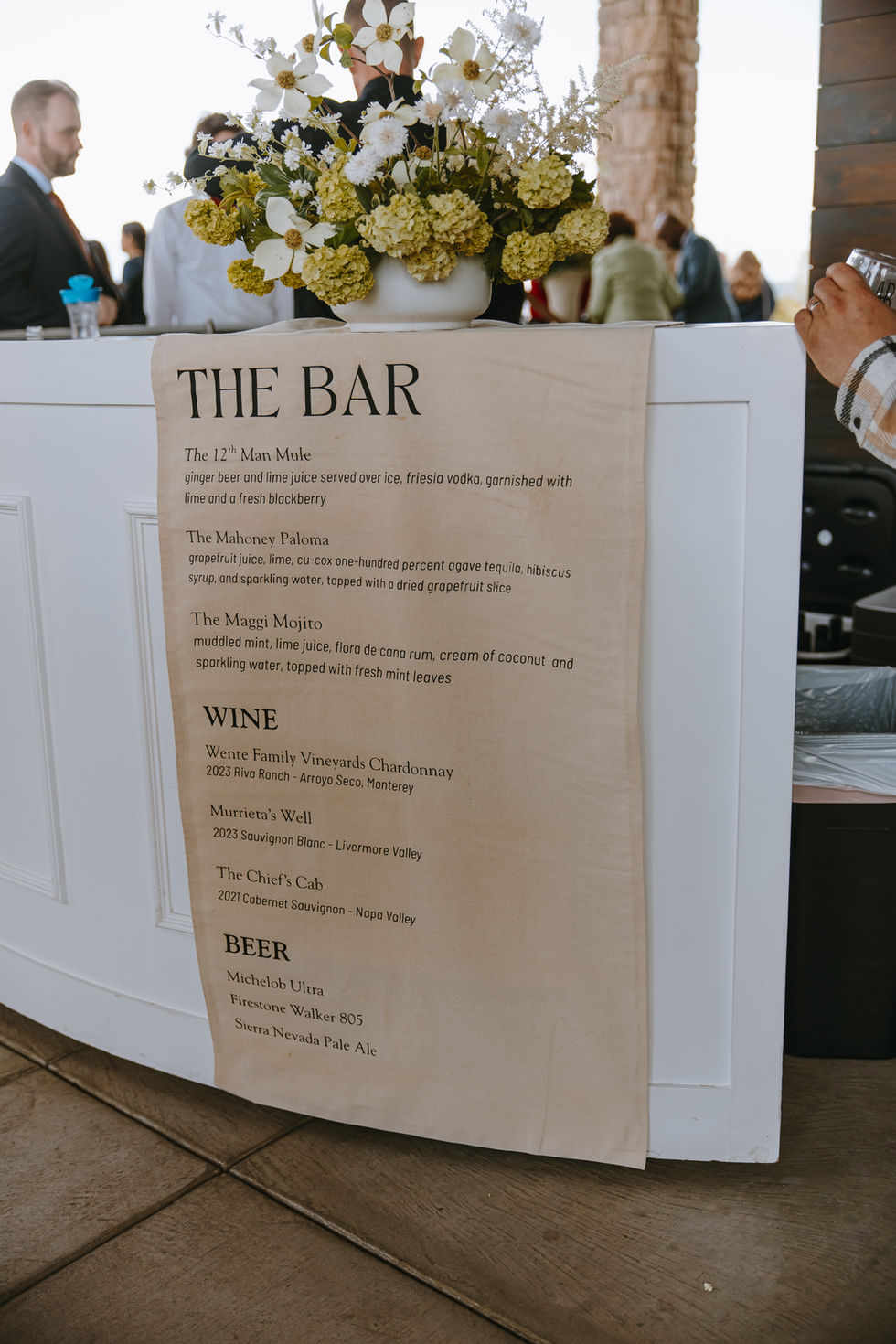 a menu for the wedding bar includes wine and beer
