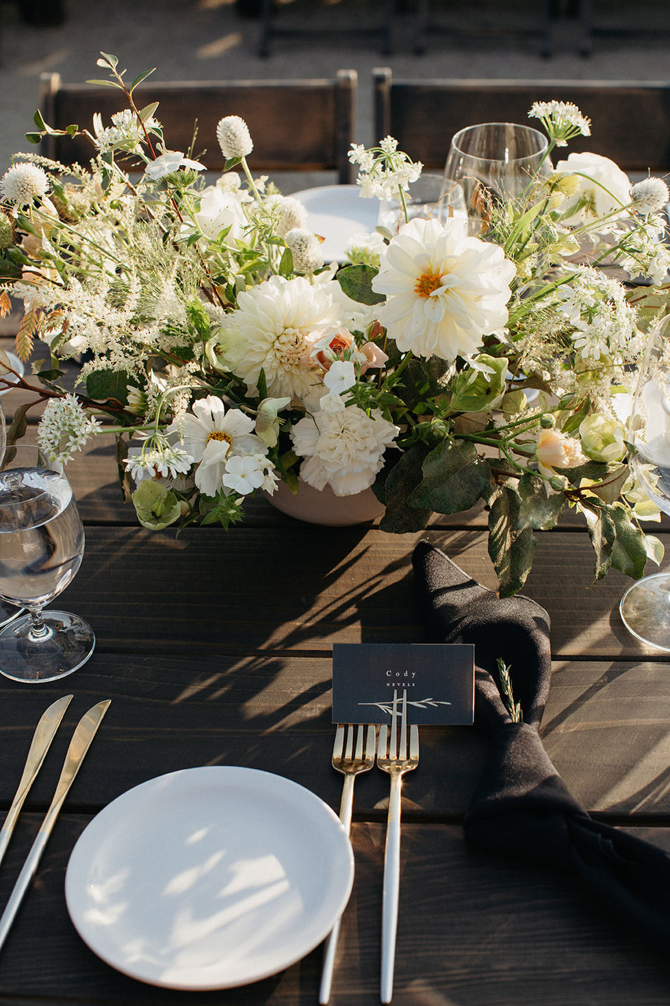 a place setting with a card that says cady smith