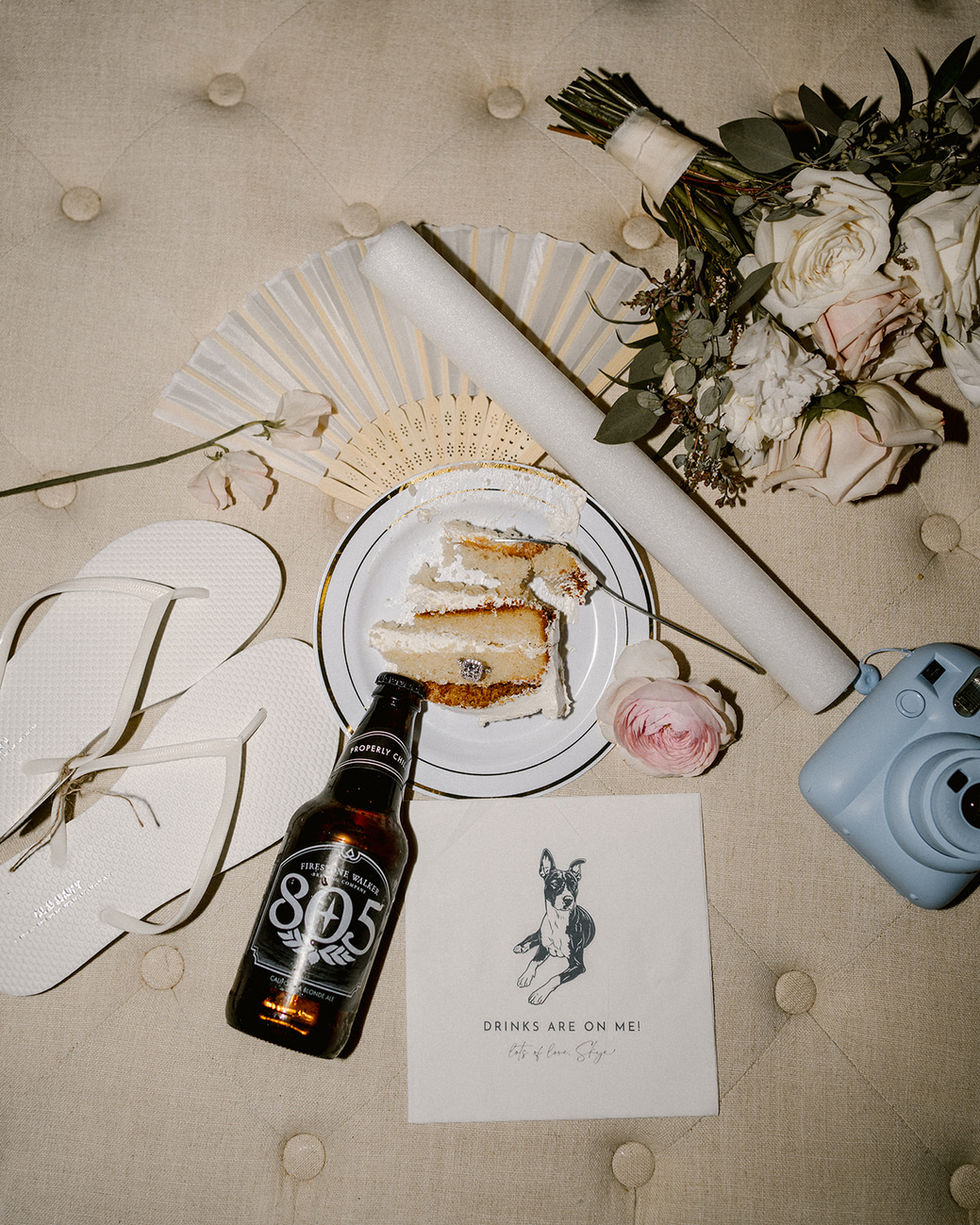 a bottle of 805 beer sits next to a plate of cake