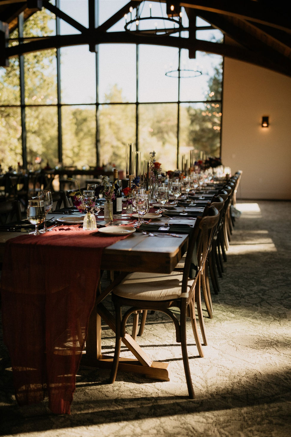 a long table with plates and glasses on it