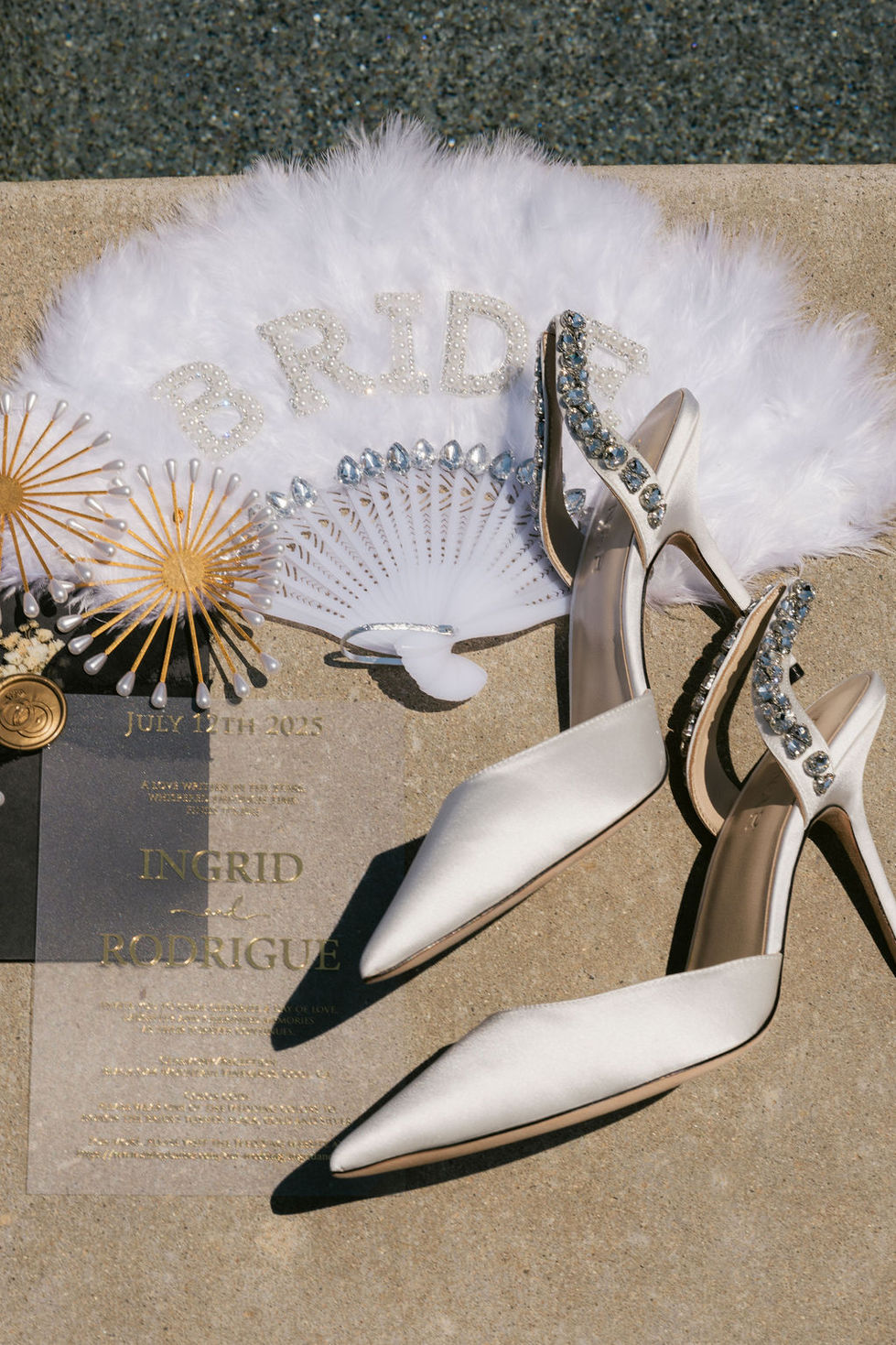 a fan with the word bride on it sits next to a pair of shoes