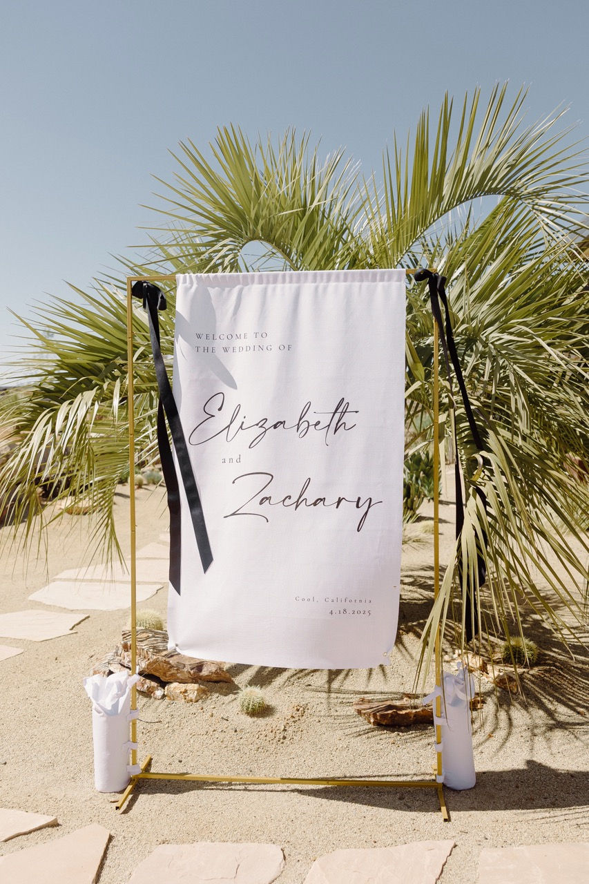 a sign that says welcome to the wedding of elizabeth and zachary