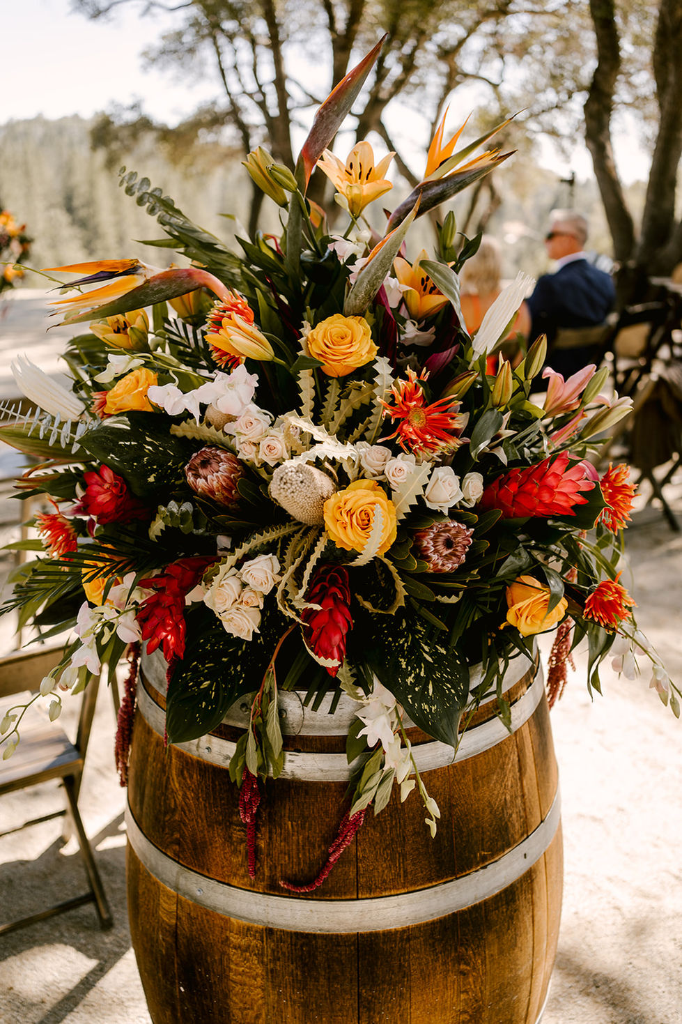 a wooden barrel is decorated with flowers and leaves