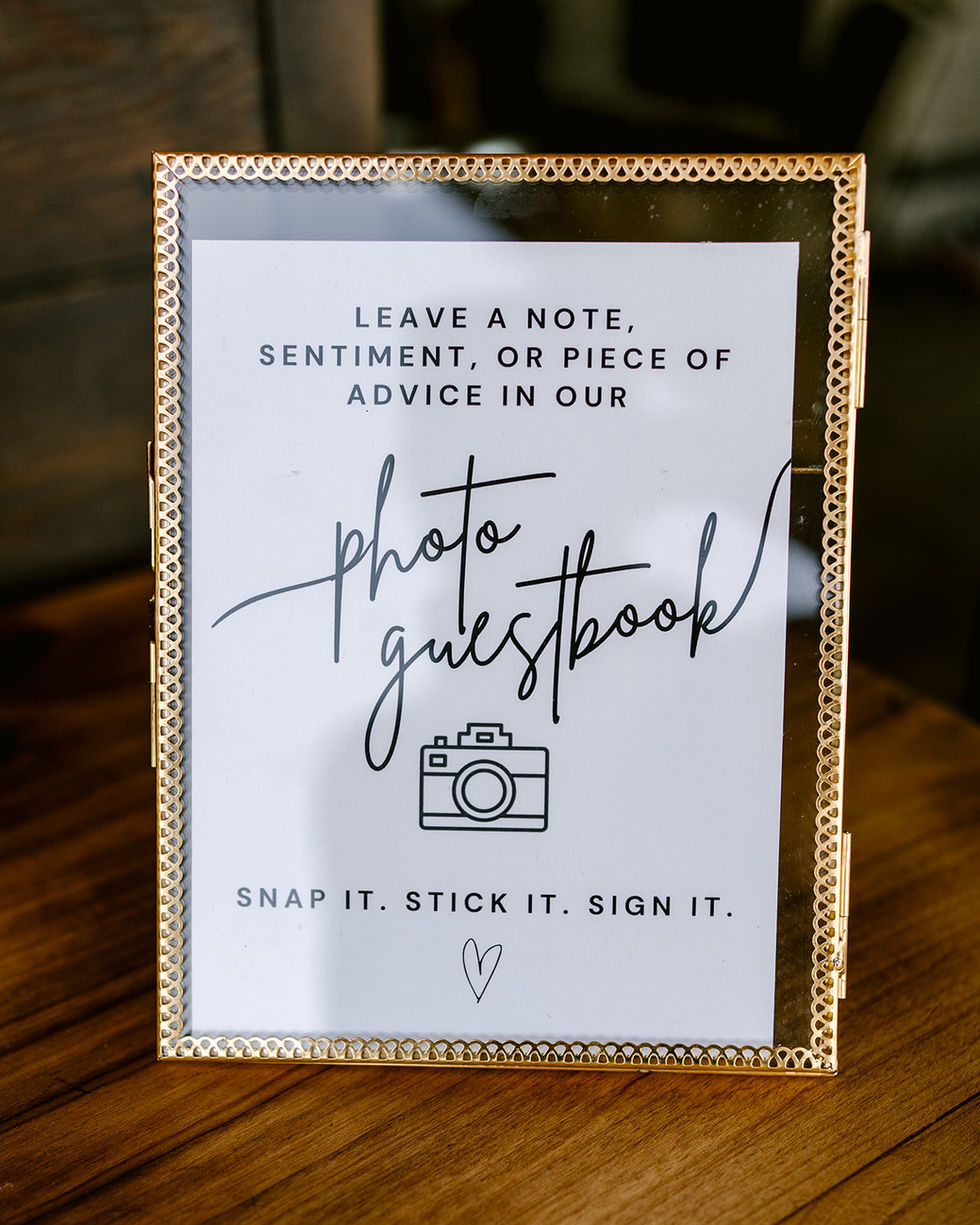 a sign that says leave a note sentiment or piece of advice in our photo guestbook