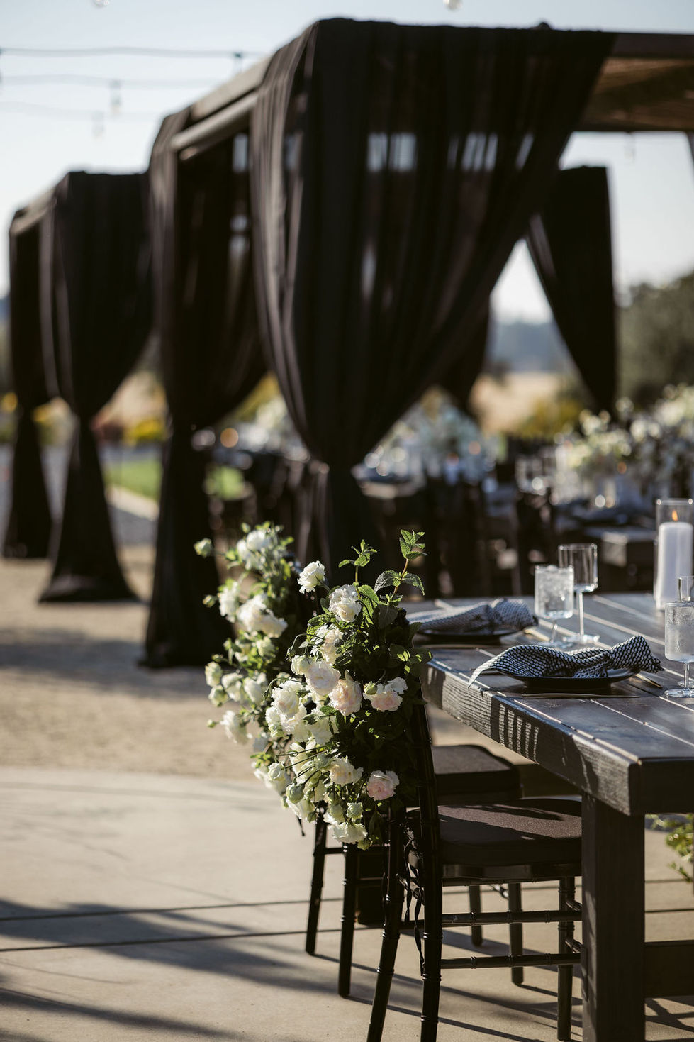 a wooden table with white flowers on it