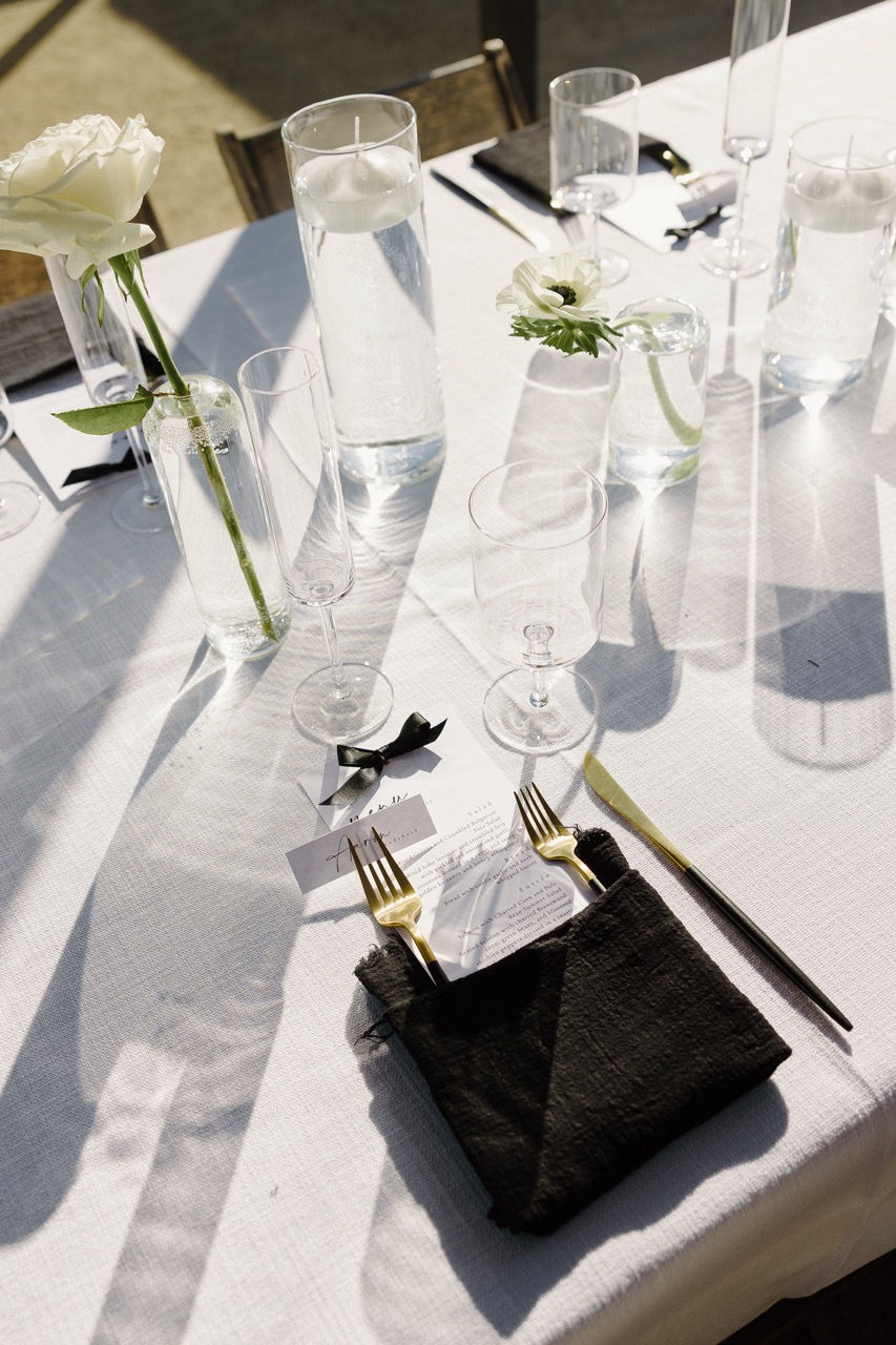 a place setting with a menu on a napkin