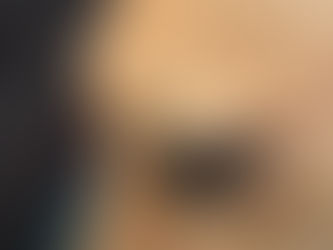 A close-up photo of a tan colored puppy.