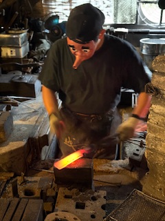 A metalwork at his shop in Japan