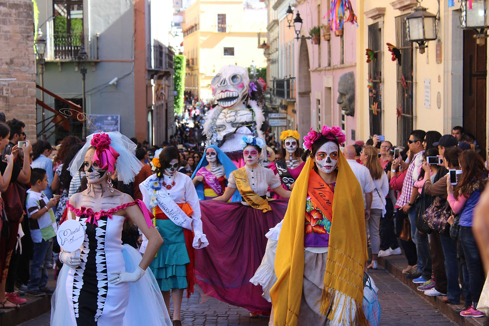 Women in costume walking through the streets of Leon, Mexico in parade