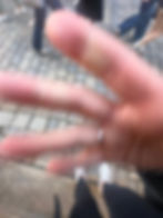 Six people at one end of a table, about to share a meal