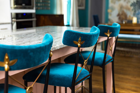 Teal velvet kitchen counter stools with brass metal accents