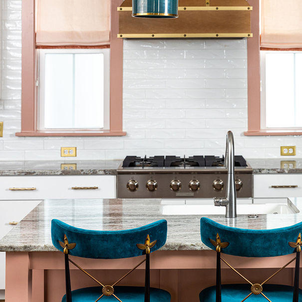 Teal velvet kitchen island chairs, brass and wood range hood