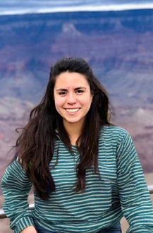 Karen Castro, LPC, smiling outdoors in natural light, wearing a blue blouse.