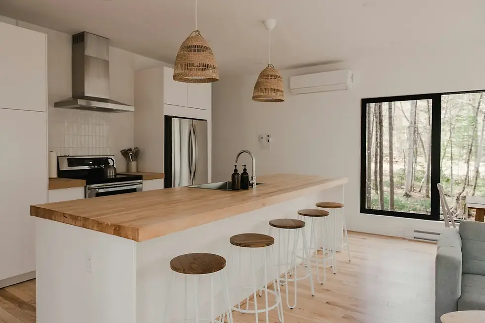 Natural wood kitchen countertop with warm tones and woven pendant lights