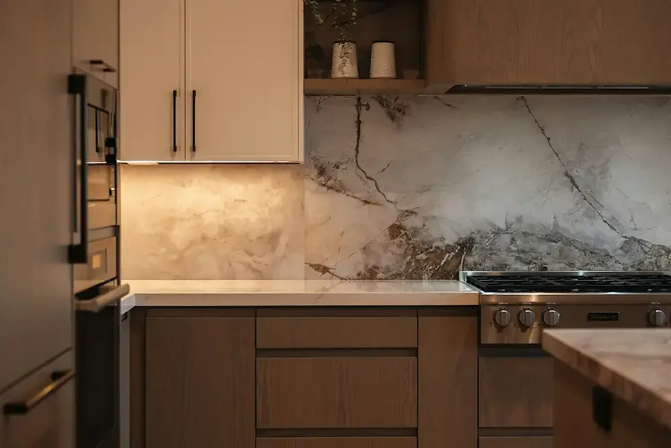 Under-cabinet LED strip at 3000K casting warm glow on marble backsplash the $40 lighting hack that changes everything