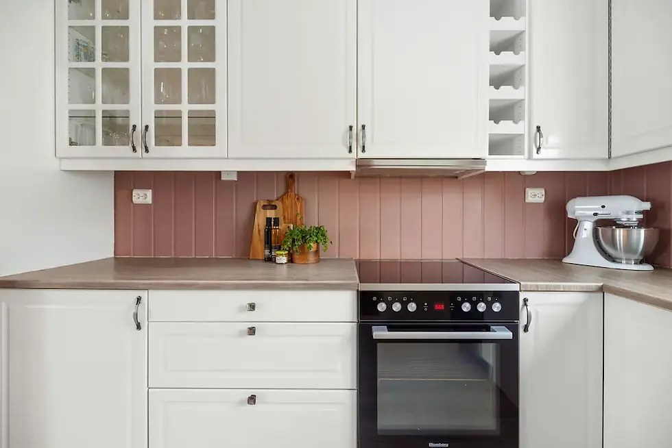 White painted kitchen cabinets with glass fronts and tile backsplash cabinet repainting result with bonding primer