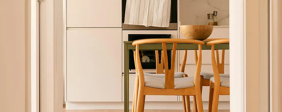 Scandinavian kitchen with natural wood chairs and warm minimal design