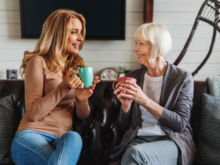 Daughter visiting her elderly mother