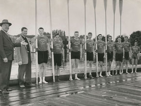 UBC-Vancouver Rowing Club Crew, with coach Frank Read, second from left, and Col. Victor Spencer, left, presenting the crew with their brand new hand-built Pocock 8-seat wooden racing shell. Salt Springer Doug McDonald is the third rower from the left, Tom Toynbee is fourth from the right, counting the coxswain at far right. (Photo courtesy Tom Toynbee)