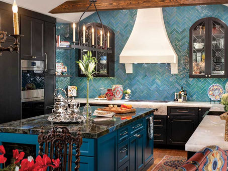 Kitchen with bold navy cabinets and custom tile backsplash reflecting homeowner's personal style