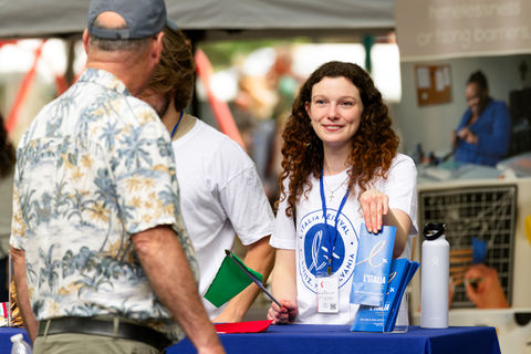 L'Italia Festival volunteer welcoming attendees
