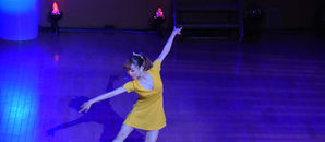 a ballet dancer wearing yellow dress