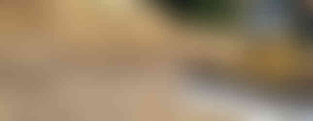 A Komatsu bulldozer working on building a dam for a pond installation in Martinsville, IN