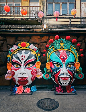 Two colorful peking opera masks displaye