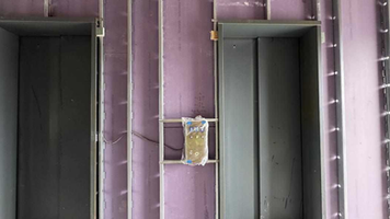 Group 18 Paragon elevator installation and interior wall progress