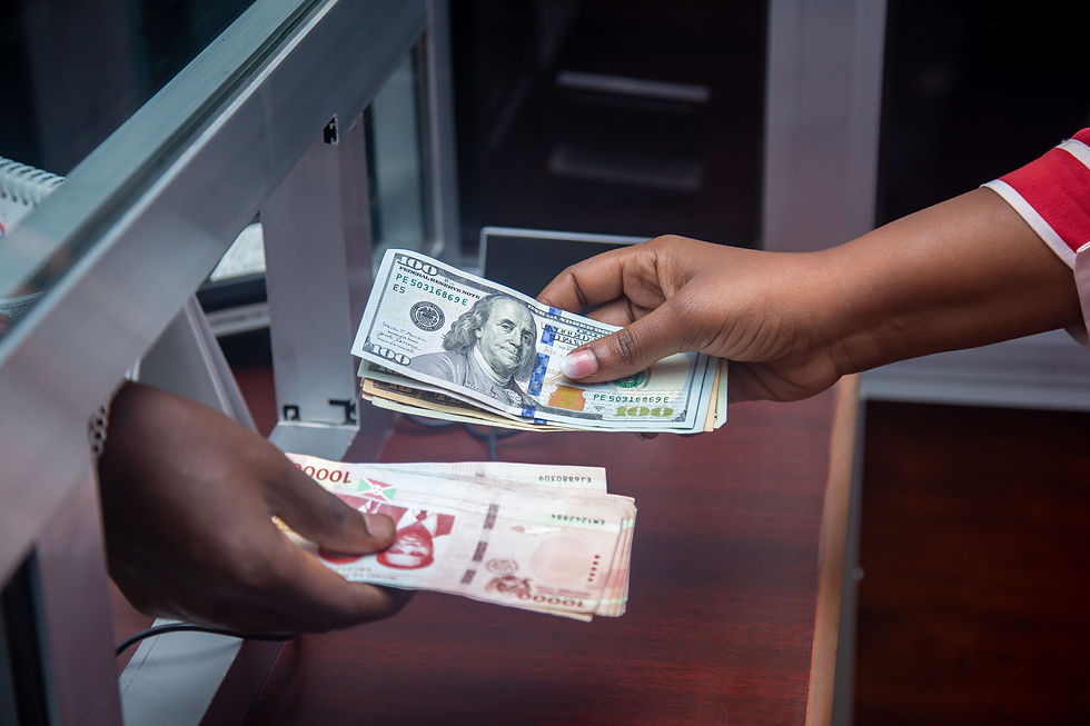 Hands exchanging currency representing the EB-5 path of funds and international transfer of investment capital.