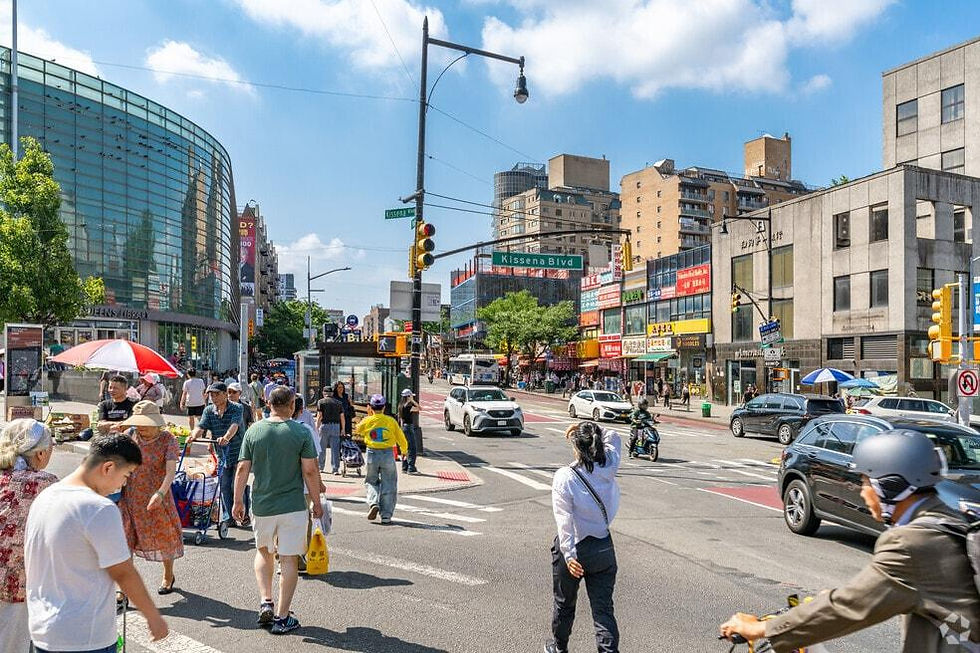 Pedestrians, traffic and neighborhood storefronts near Kissena Boulevard in Downtown Flushing, Queens