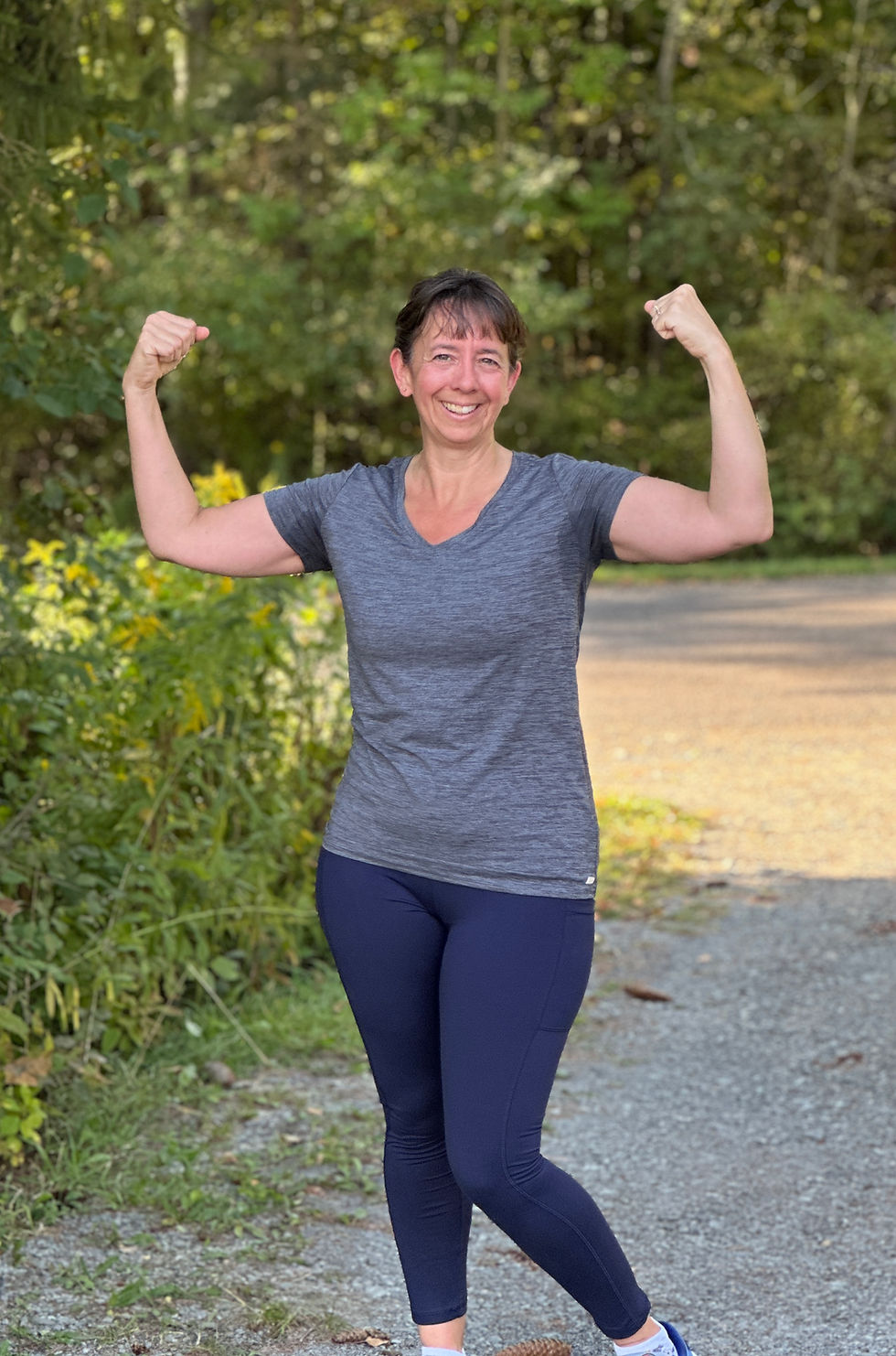 Real life post-run photo – woman smiling and flexing after workout – Healthy Made Easy encouragement