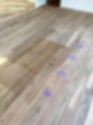 Bleached Spotted gum timber flooring sample with taped sections showcases the natural grain and color variations.